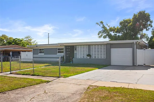 a view of a backyard with a swimming pool