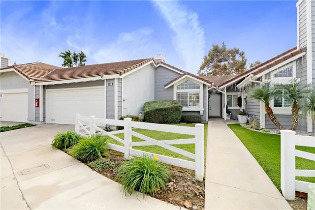 a front view of a house with swimming pool