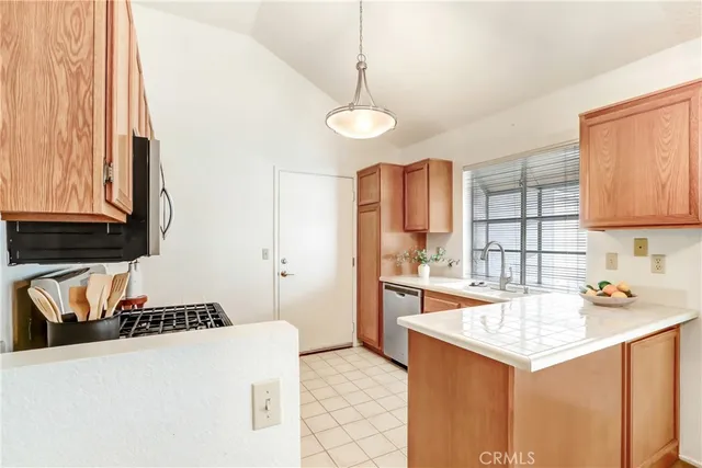 a kitchen that has a cabinets and a stove