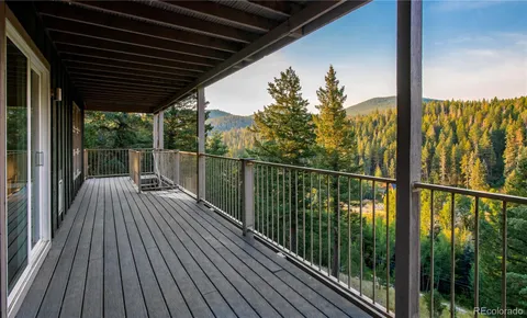 a view of balcony with wooden floor