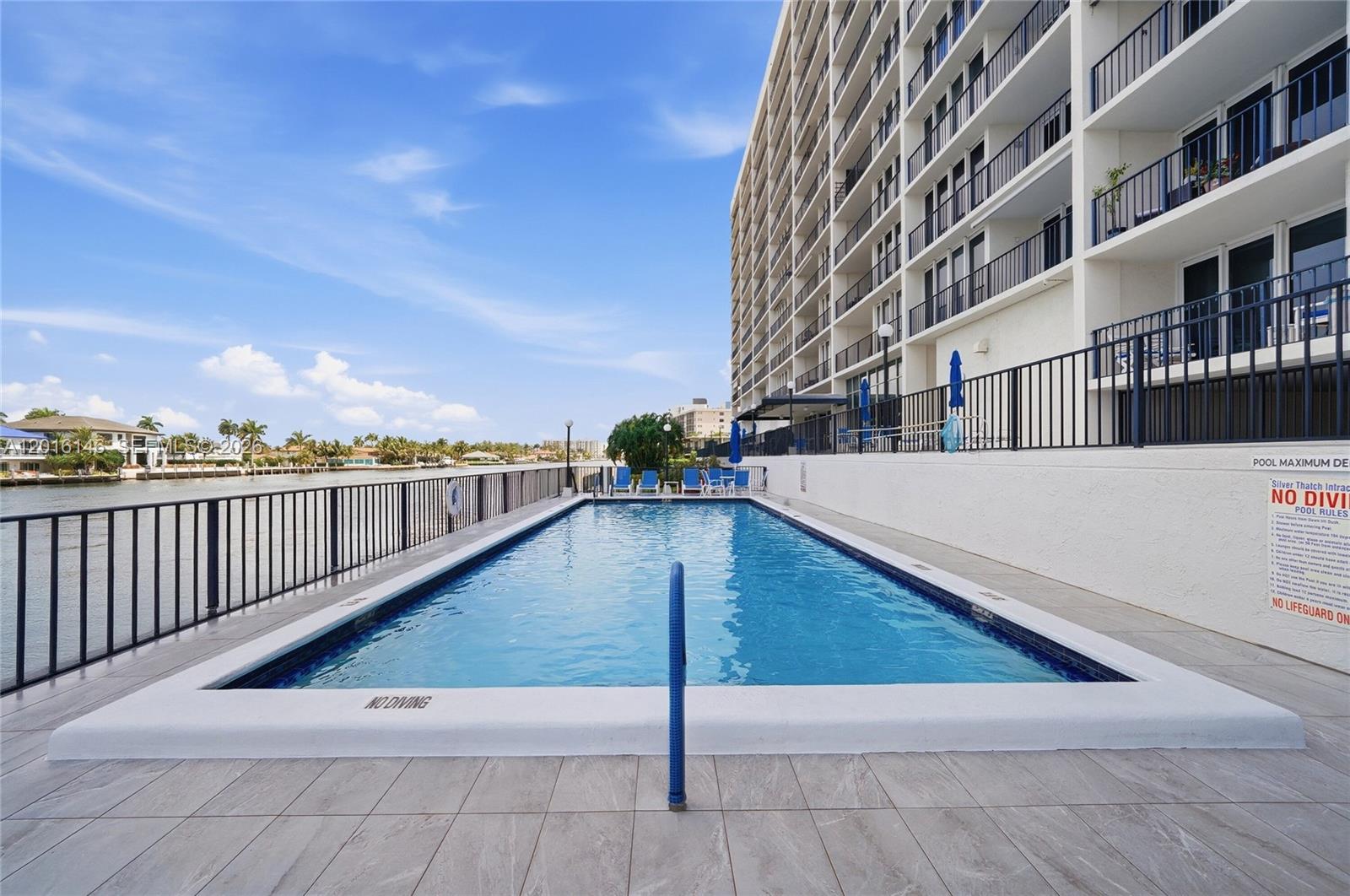 521 North Riverside Drive, Unit 606 Pompano Beach, FL 33062 - Photo 35 of 50 a view of swimming pool with a chairs