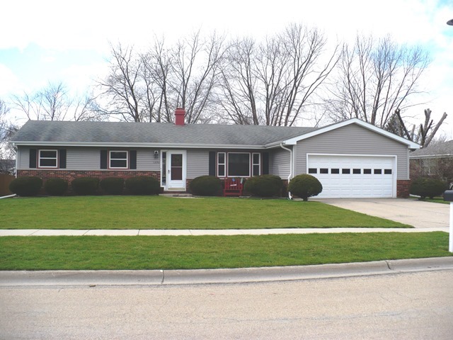 1230 Springdale Drive Rochelle, IL 61068 - Photo 1 of 22 a view of a house that has a yard