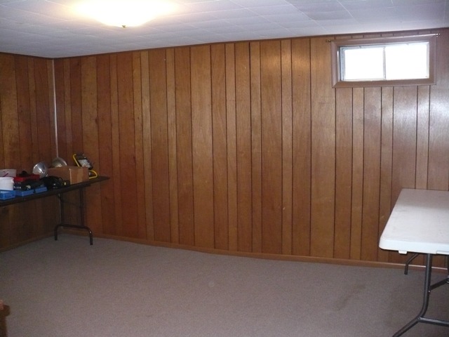1230 Springdale Drive Rochelle, IL 61068 - Photo 17 of 22 a view of a room with a wooden door and furniture