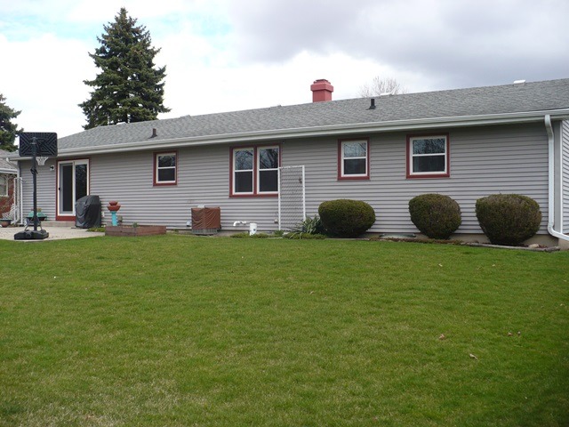 1230 Springdale Drive Rochelle, IL 61068 - Photo 20 of 22 a front view of a house with garden