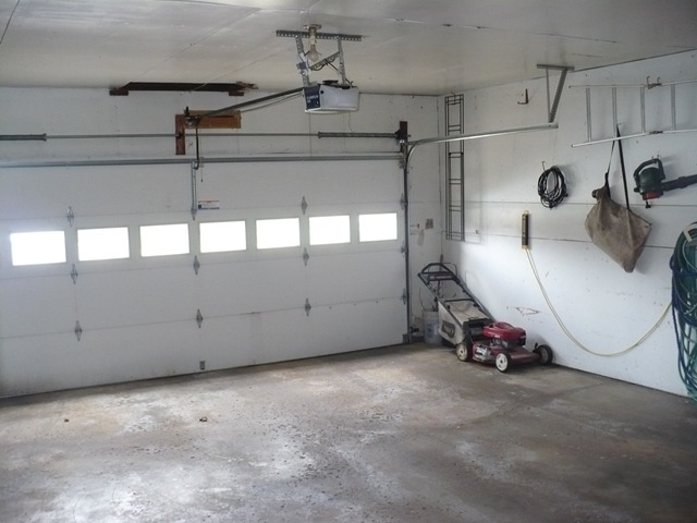 1230 Springdale Drive Rochelle, IL 61068 - Photo 22 of 22 a view of a garage with rack and bicycle