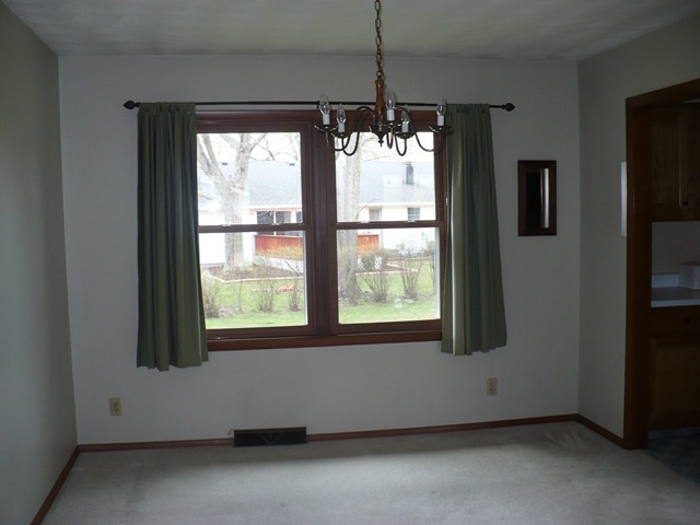 1230 Springdale Drive Rochelle, IL 61068 - Photo 10 of 22 a room with window and stairs