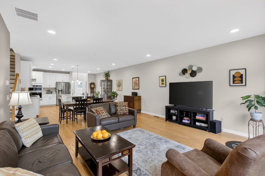 87 Shannon Way, Unit 86 Upton, MA 01568 - Photo 5 of 36 a living room with furniture and a flat screen tv