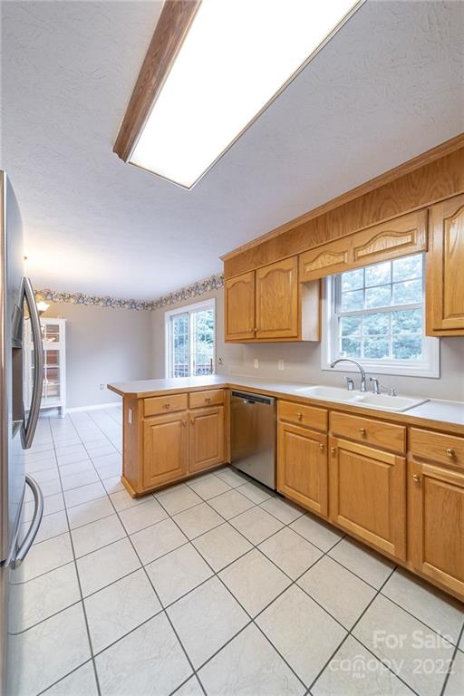 3446 Raintree Drive Hudson, NC 28638 - Photo 11 of 24 a kitchen with stainless steel appliances cabinets a sink and a large window