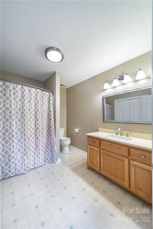 3446 Raintree Drive Hudson, NC 28638 - Photo 13 of 24 a bathroom with a double vanity sink and a mirror