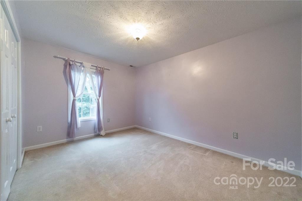 3446 Raintree Drive Hudson, NC 28638 - Photo 16 of 24 an empty room with windows and entrance