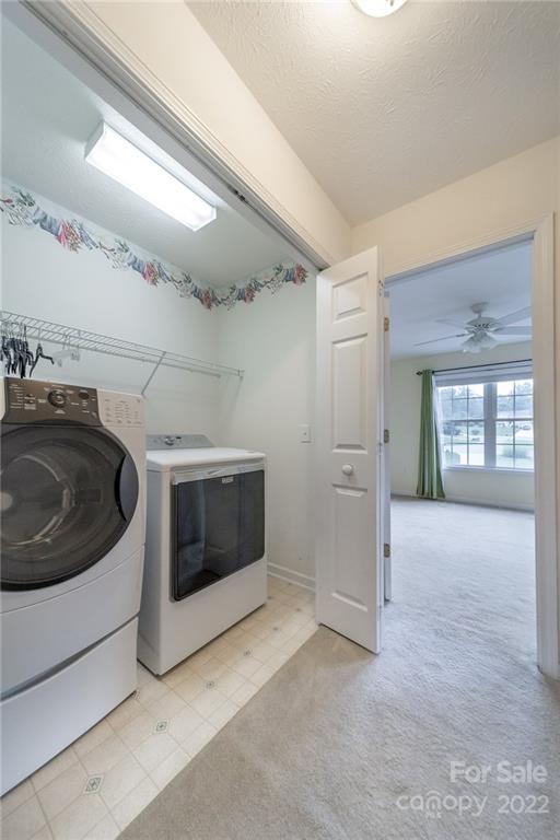 3446 Raintree Drive Hudson, NC 28638 - Photo 18 of 24 a view of a hallway with washer and dryer