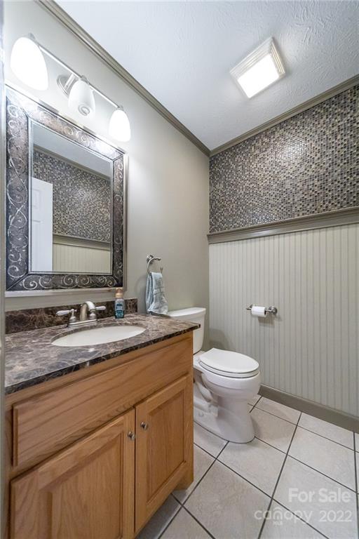 3446 Raintree Drive Hudson, NC 28638 - Photo 20 of 24 a bathroom with a granite countertop toilet sink and mirror
