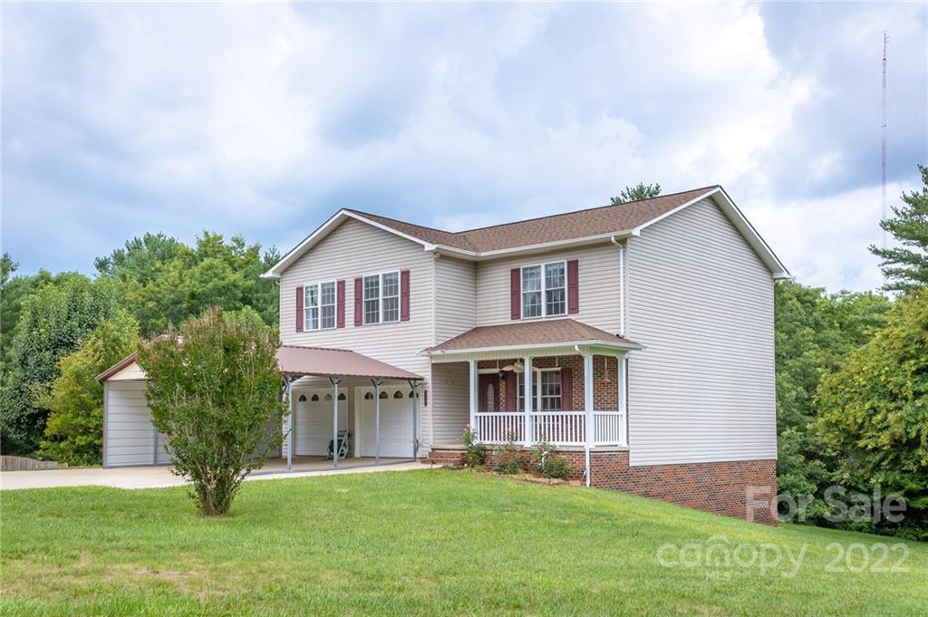 3446 Raintree Drive Hudson, NC 28638 - Photo 2 of 24 a house view with a garden space