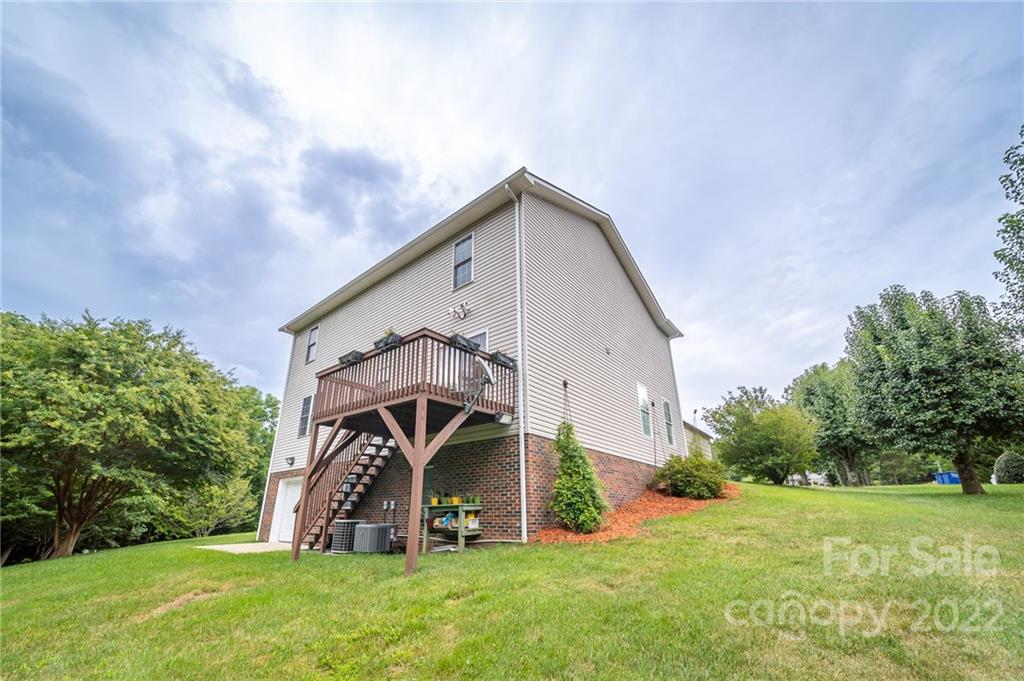 3446 Raintree Drive Hudson, NC 28638 - Photo 23 of 24 a view of an house with backyard and garden