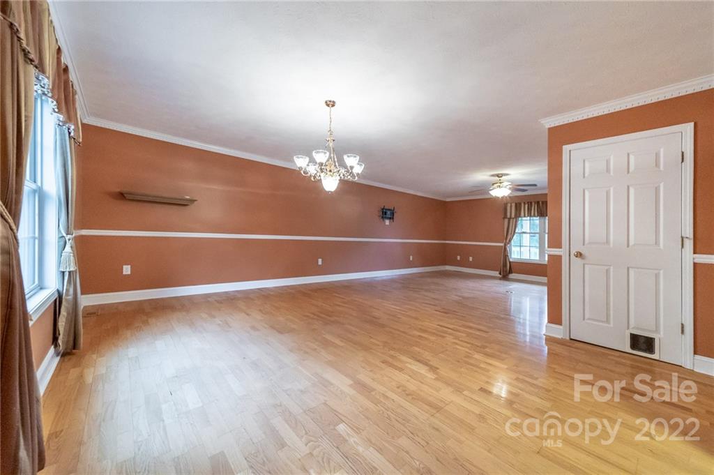 3446 Raintree Drive Hudson, NC 28638 - Photo 5 of 24 a view of a room with wooden floor and chandelier