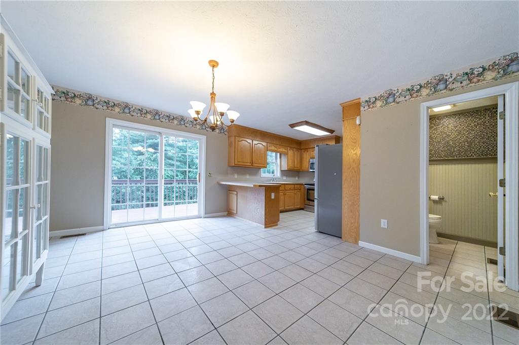 3446 Raintree Drive Hudson, NC 28638 - Photo 7 of 24 a view of a kitchen with furniture and a fireplace