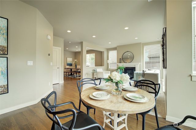 a view of a dining room with furniture and a table