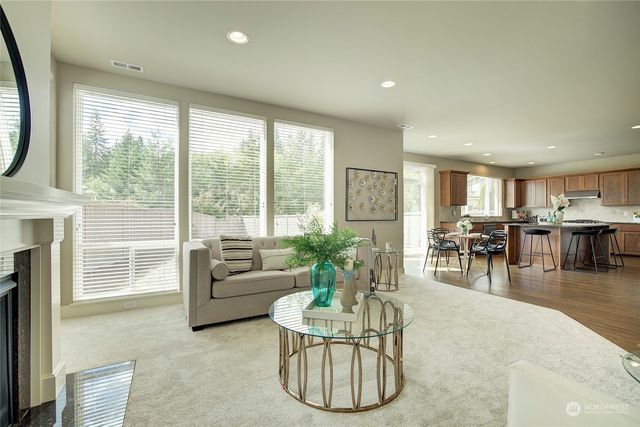 a living room with furniture and a table