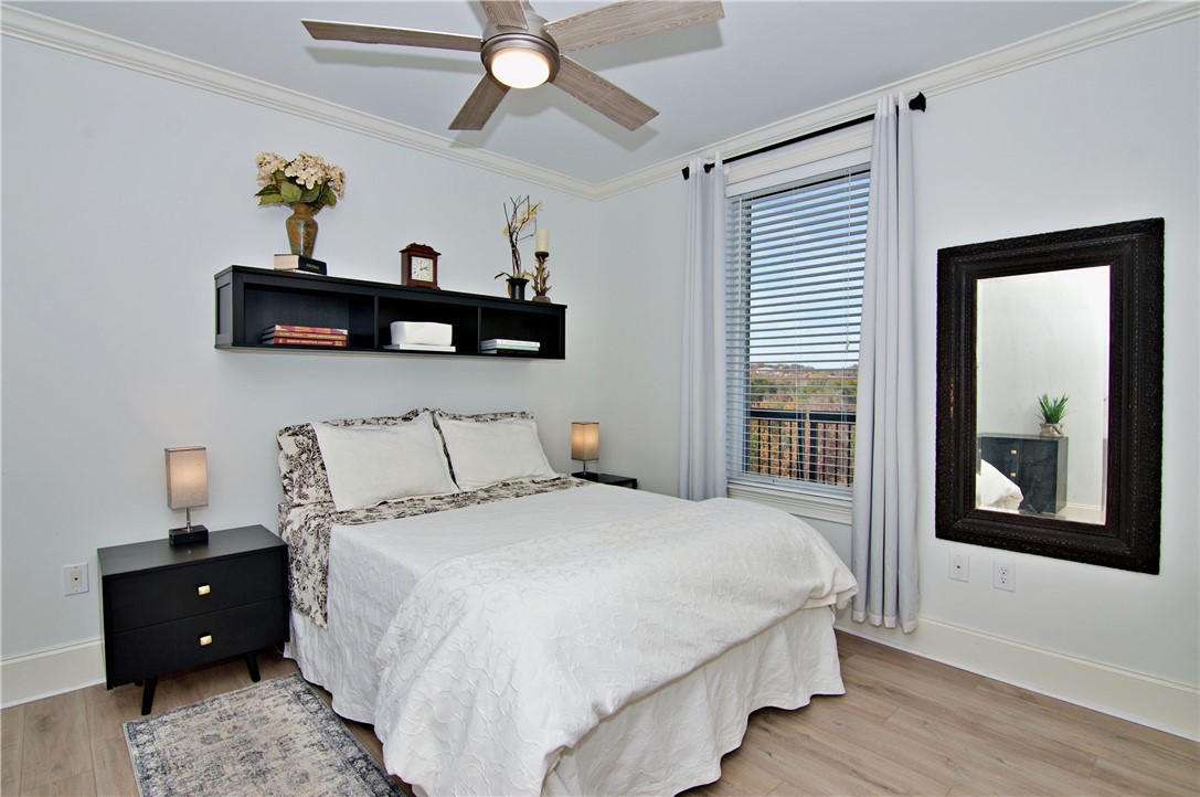601 Watermarke Lane Anderson, SC 29625 - Photo 12 of 25 This bright bedroom offers hardwood flooring and ample natural light, creating a serene and inviting atmosphere.