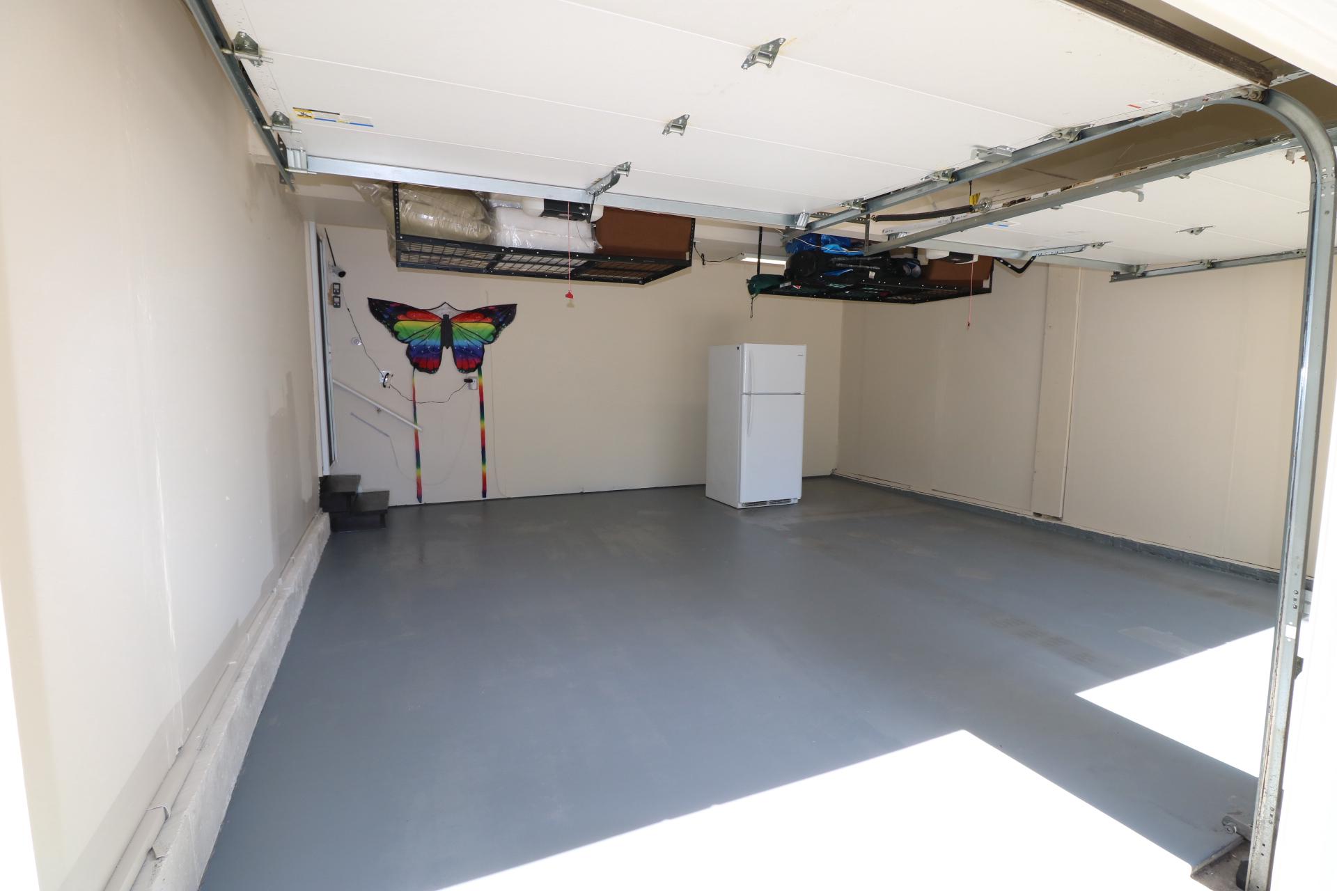 11901 Rustic Farm Court Germantown, MD 20874 - Photo 130 of 134 Spacious garage with ceiling storage hanger