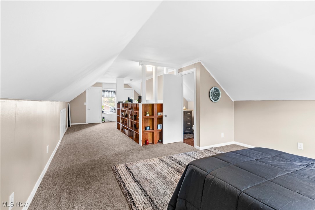 540 Park Road Painesville, OH 44077 - Photo 24 of 34 Bedroom with carpet flooring and vaulted ceiling