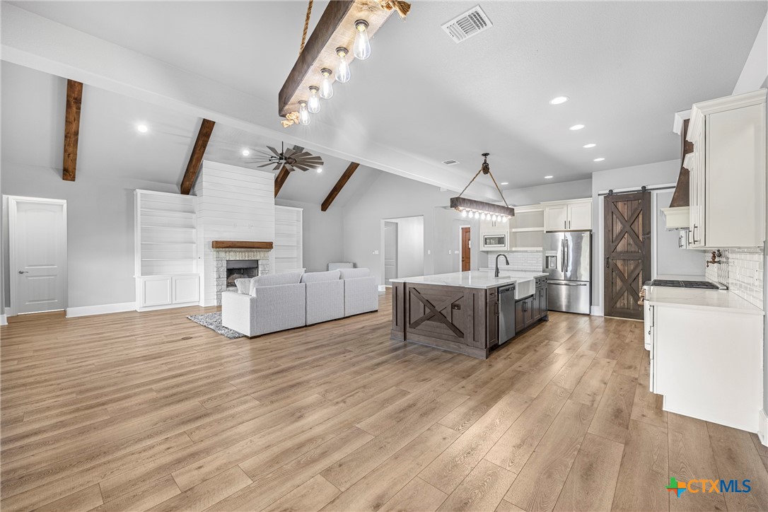 360 Grove Road Killeen, TX 76542 - Photo 13 of 48 a living room with furniture and a wooden floor