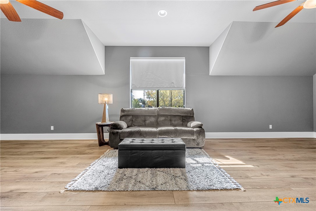 360 Grove Road Killeen, TX 76542 - Photo 26 of 48 a living room with a couch and a rug