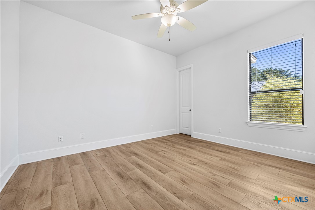 360 Grove Road Killeen, TX 76542 - Photo 30 of 48 a view of an empty room with wooden floor and a window