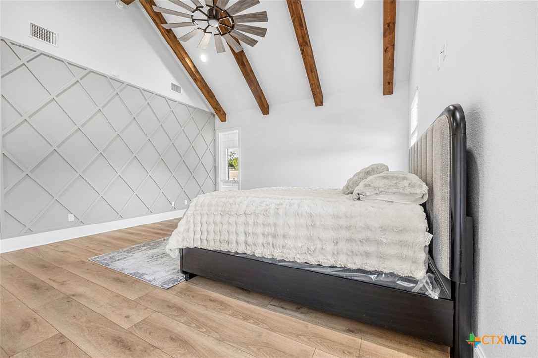 360 Grove Road Killeen, TX 76542 - Photo 34 of 48 a large bed sitting in a bedroom next to a window