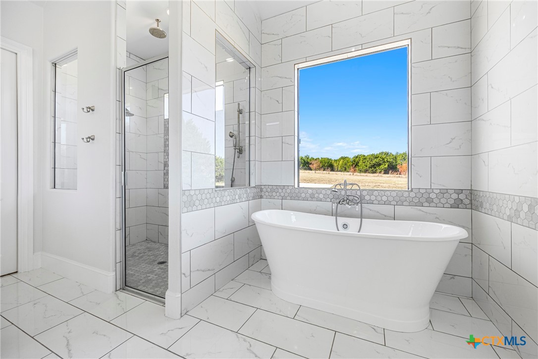 360 Grove Road Killeen, TX 76542 - Photo 36 of 48 a bathroom with a bathtub and shower
