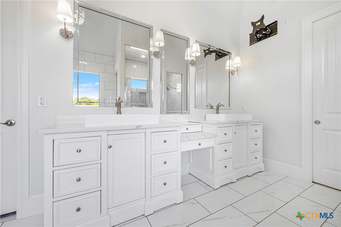 360 Grove Road Killeen, TX 76542 - Photo 37 of 48 a bathroom with a double vanity sink mirror and double