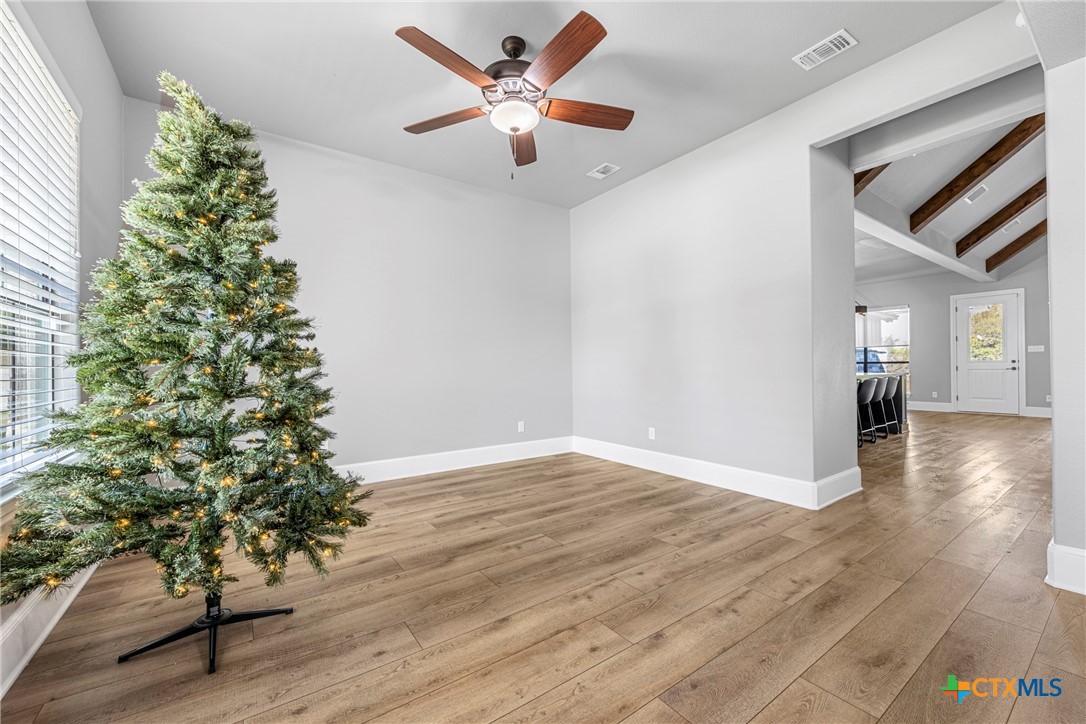 360 Grove Road Killeen, TX 76542 - Photo 8 of 48 an empty room with wooden floor and windows