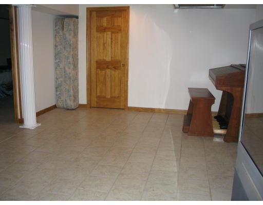 49 Newhall Street Springfield, MA 01109 - Photo 9 of 12 a view of an empty room with furniture and a window