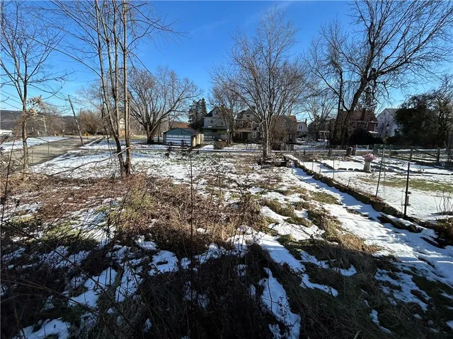 a view of a yard covered with snow
