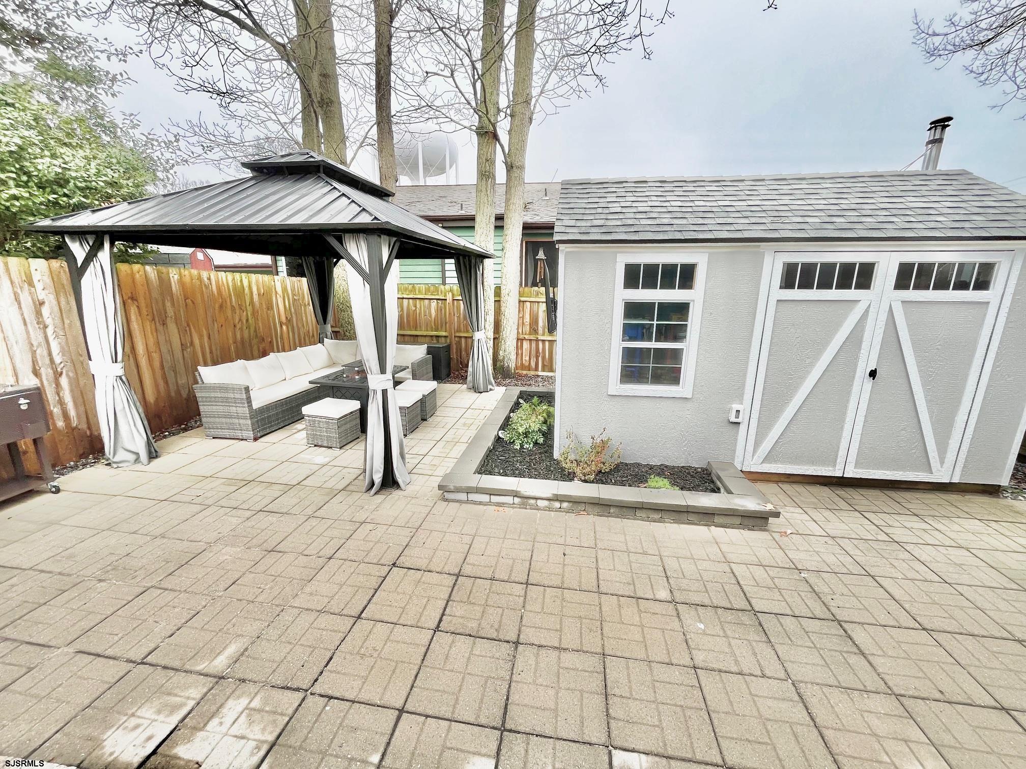 415 Rhode Island Avenue Somers Point, NJ 08244 - Photo 18 of 30 a view of a house with backyard and sitting area