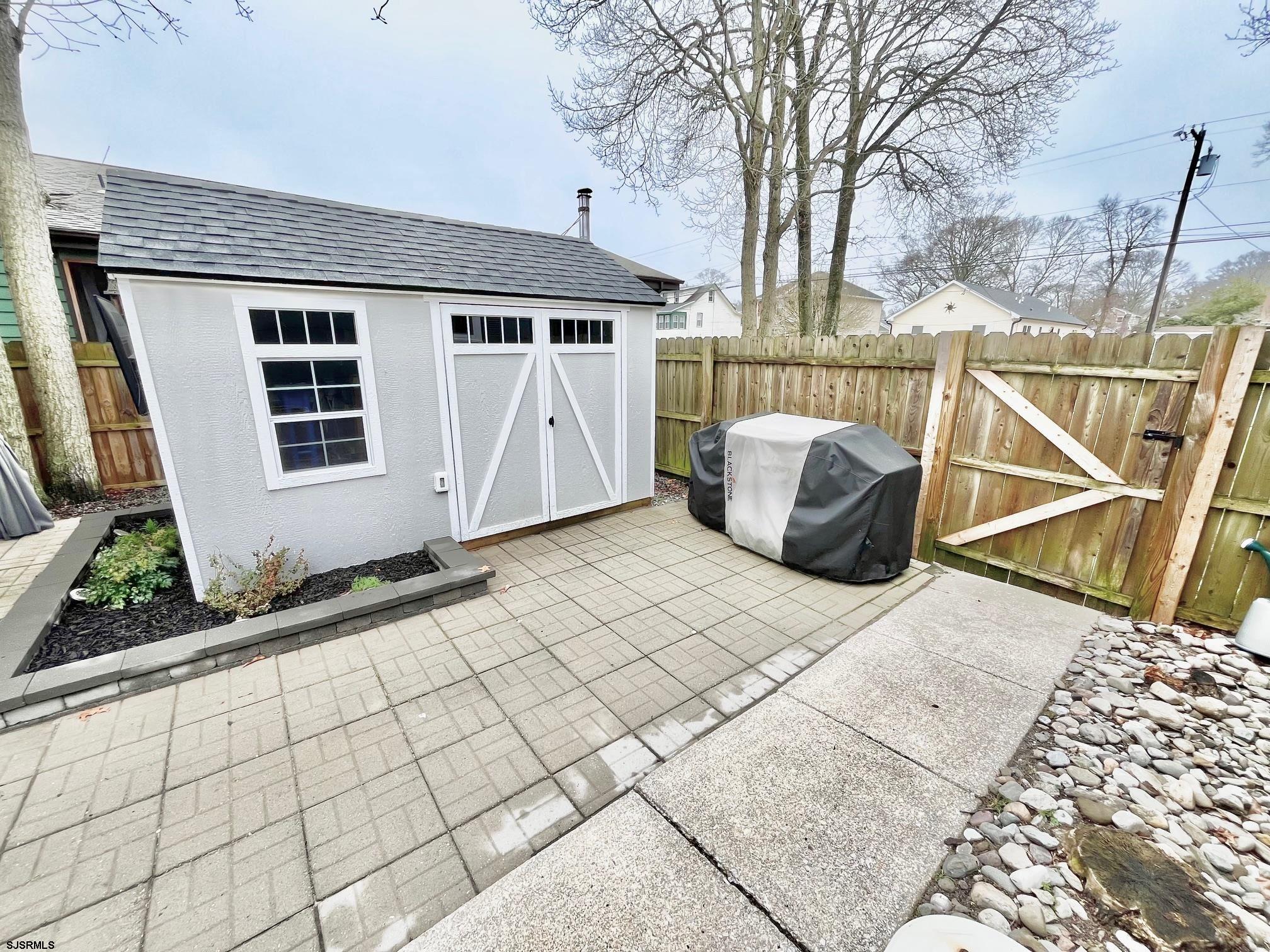 415 Rhode Island Avenue Somers Point, NJ 08244 - Photo 20 of 30 a front view of a house with a bench