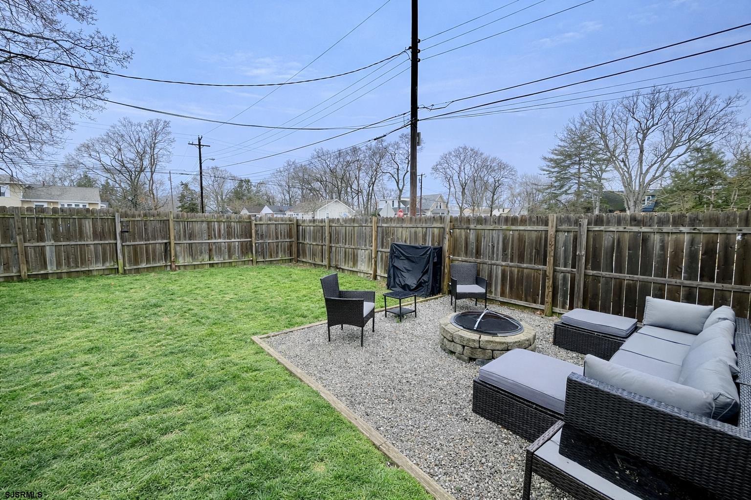415 Rhode Island Avenue Somers Point, NJ 08244 - Photo 23 of 30 a view of a backyard with couches chair and wooden floor