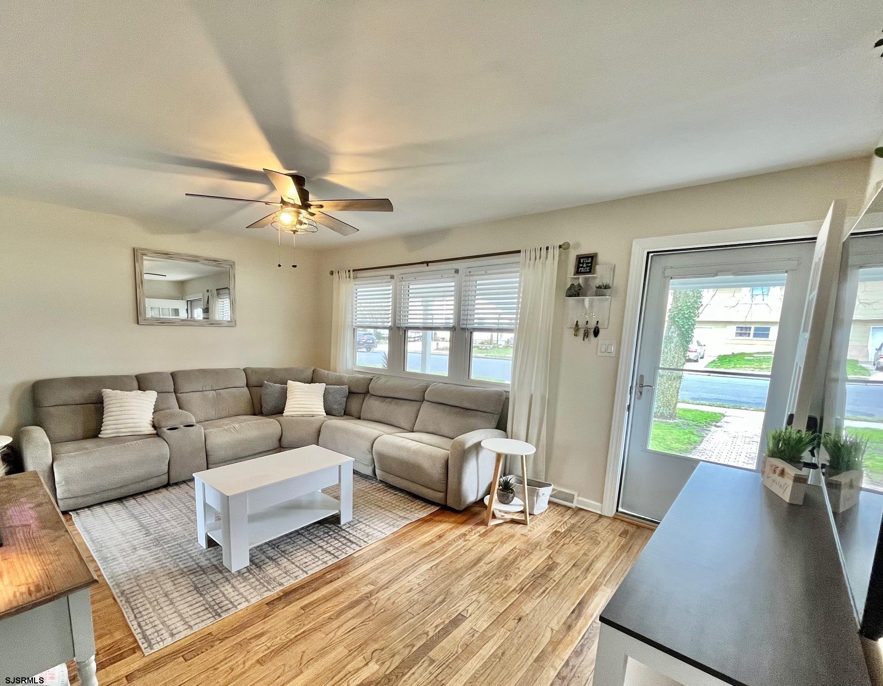 415 Rhode Island Avenue Somers Point, NJ 08244 - Photo 4 of 30 a living room with furniture and a large window