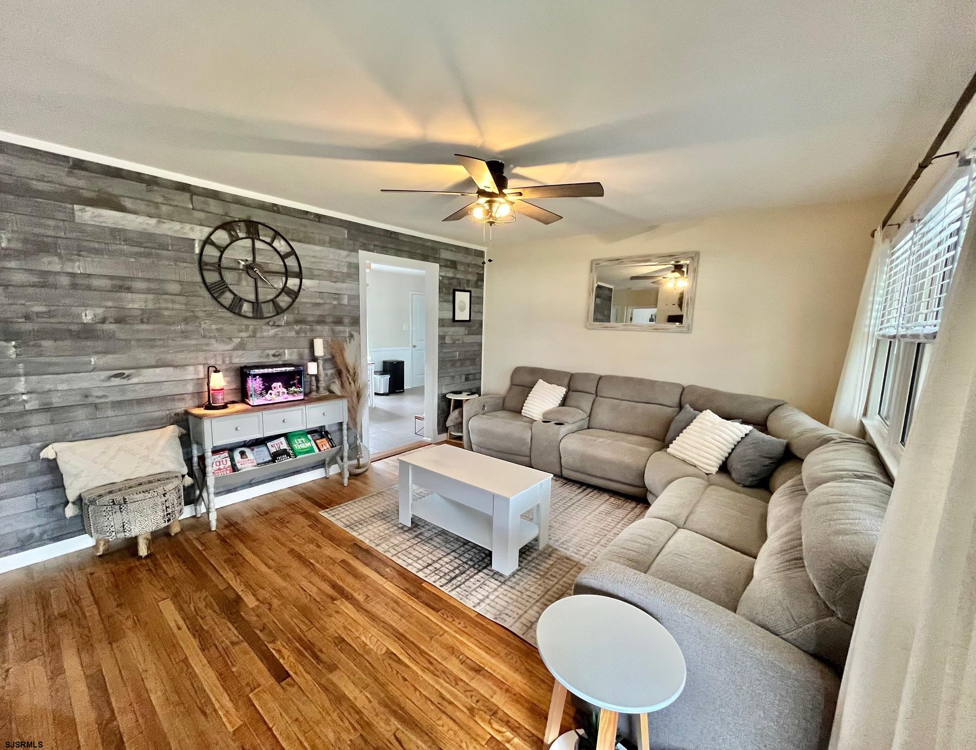415 Rhode Island Avenue Somers Point, NJ 08244 - Photo 5 of 30 a living room with furniture and a wooden floor