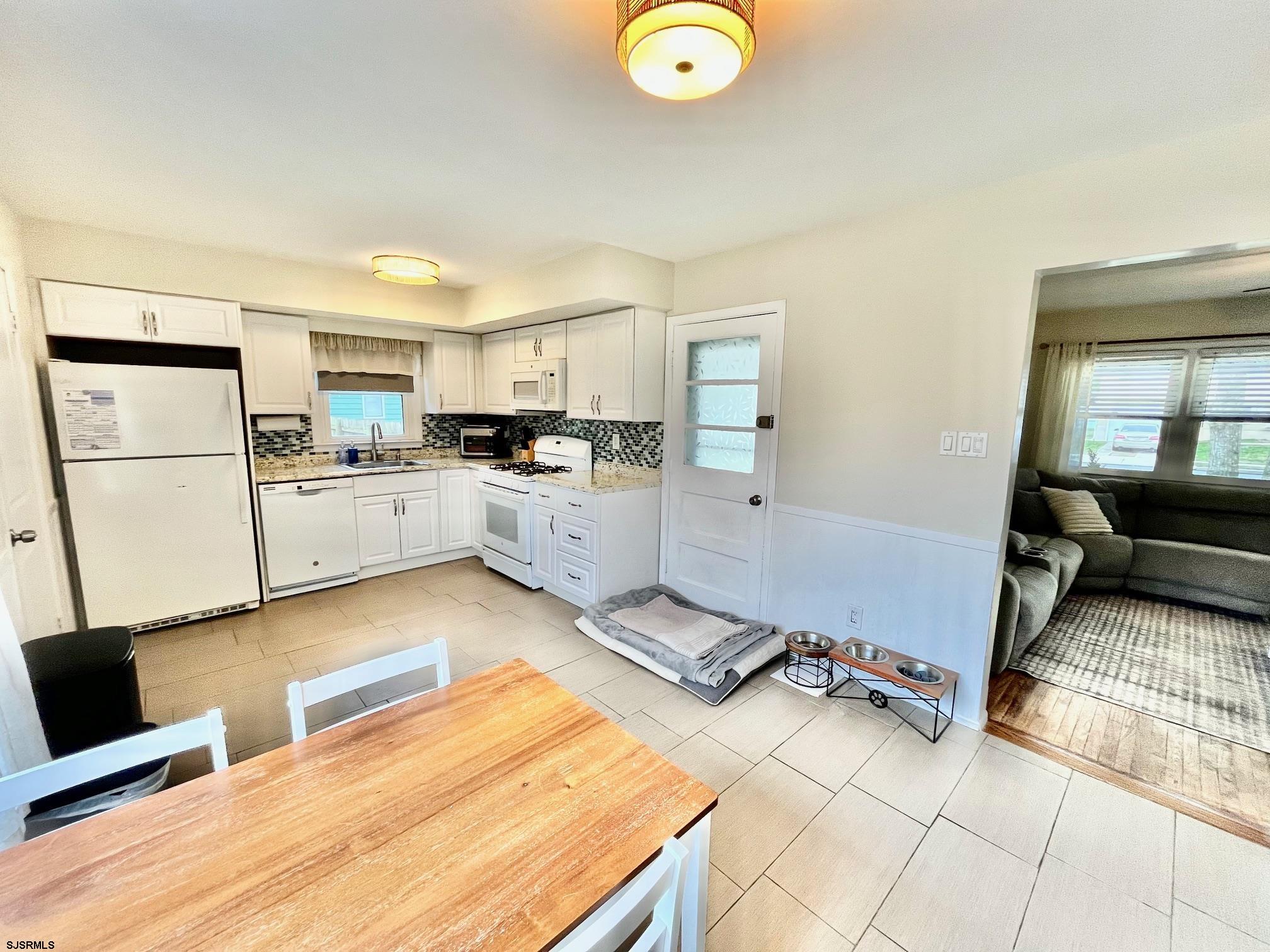 415 Rhode Island Avenue Somers Point, NJ 08244 - Photo 8 of 30 a kitchen with a sink appliances and cabinets