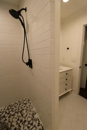 a bathroom with a bathtub and a shower