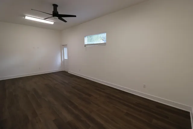 a view of wooden floor in an empty room