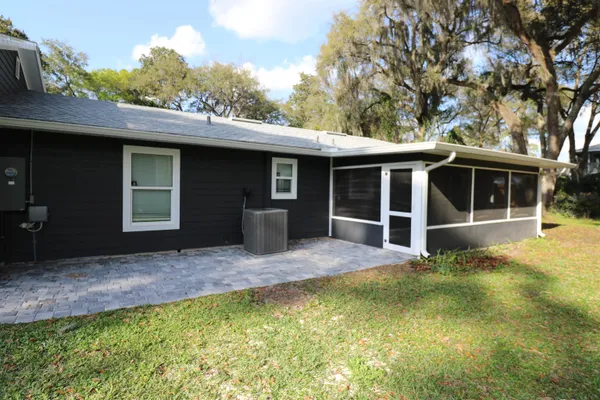 a view of house with yard and entertaining space