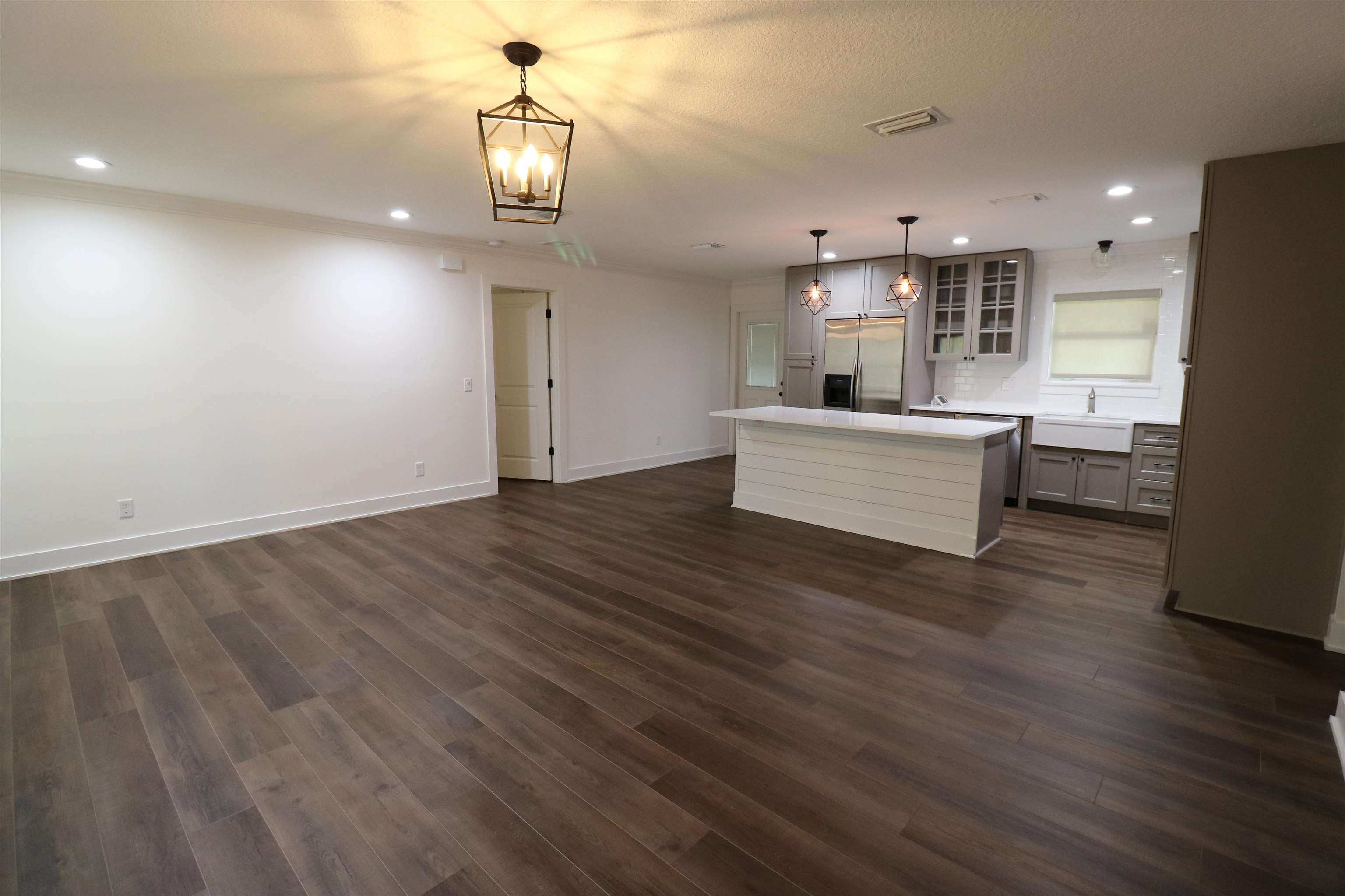 140 Seminole Road St. Augustine, FL 32086 - Photo 7 of 26 a view of kitchen and living room with wooden floor