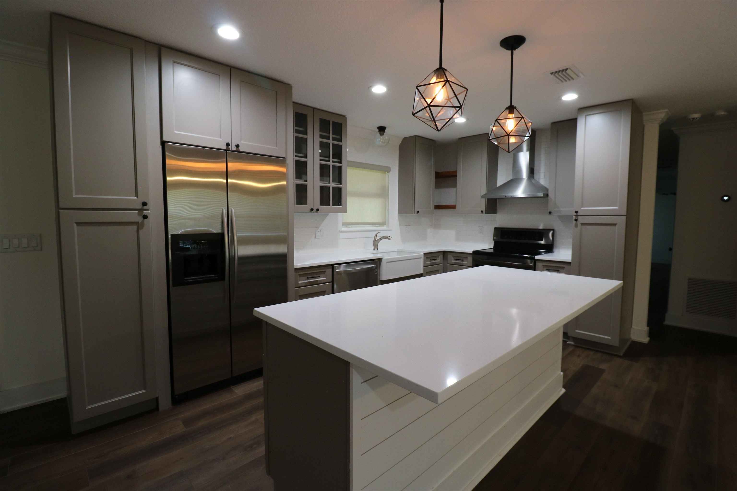 140 Seminole Road St. Augustine, FL 32086 - Photo 9 of 26 a large kitchen with stainless steel appliances a refrigerator and a wooden floor