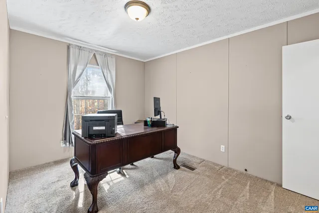 a reading room with furniture and wooden floor