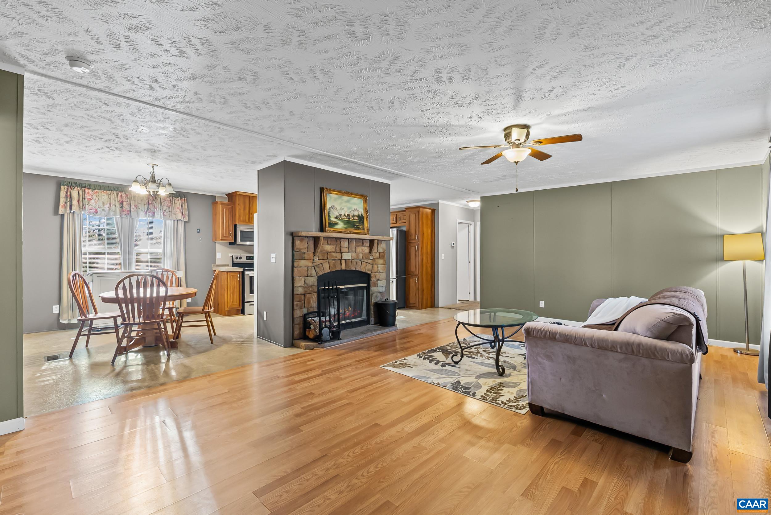 1690 Poorhouse Creek Road Appomattox, VA 24522 - Photo 4 of 44 a living room with furniture and a fireplace