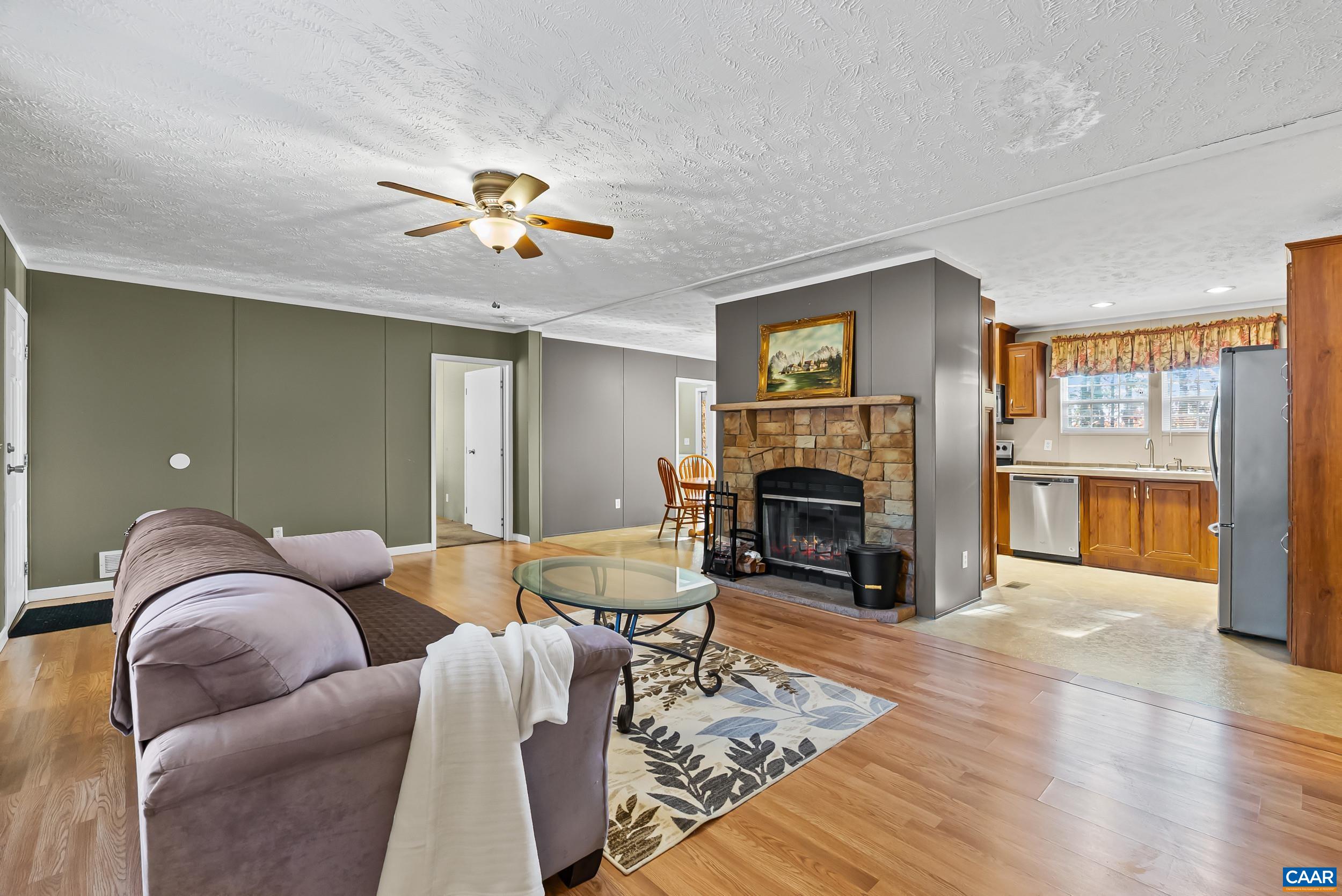1690 Poorhouse Creek Road Appomattox, VA 24522 - Photo 6 of 44 a living room with furniture and a fireplace