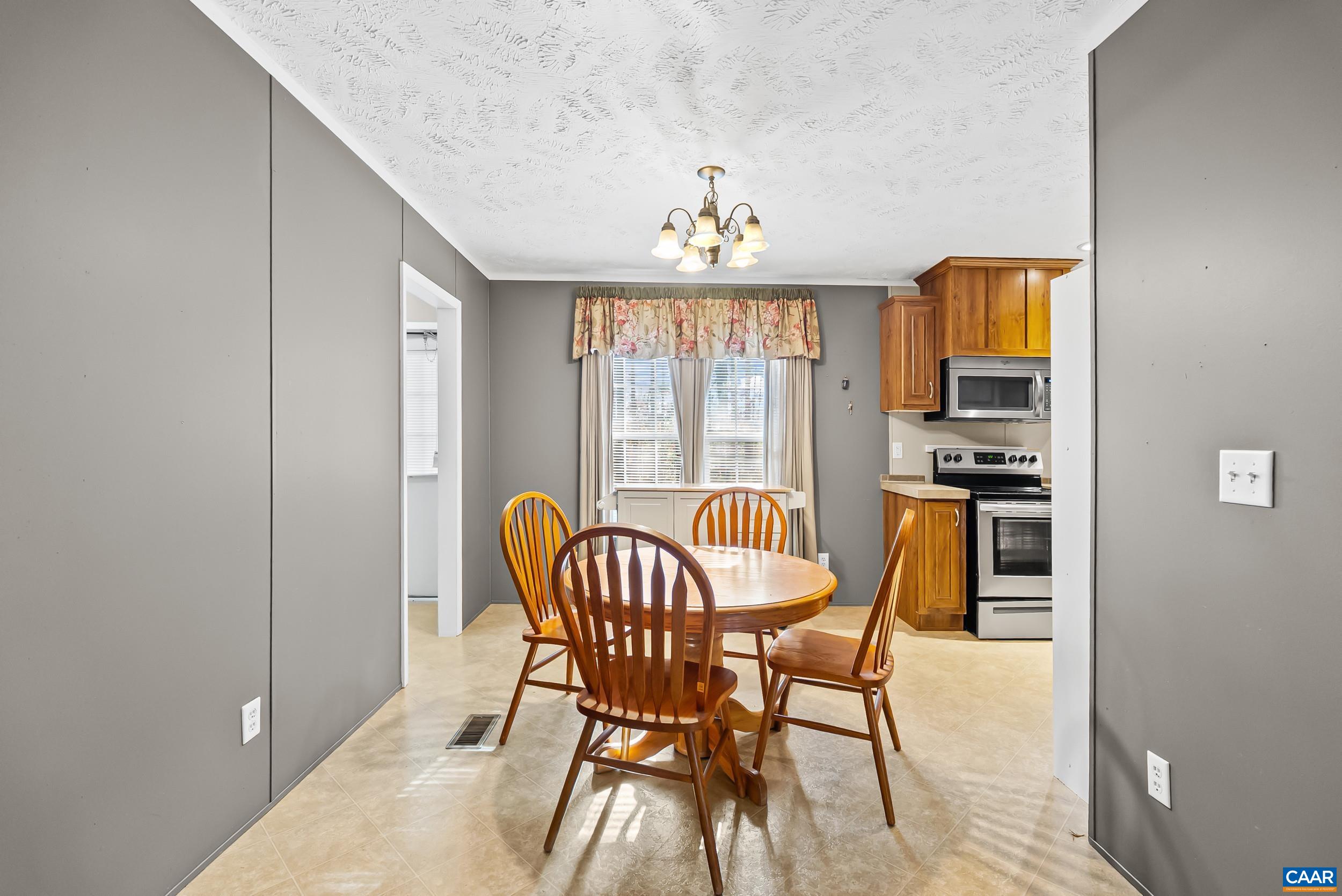 1690 Poorhouse Creek Road Appomattox, VA 24522 - Photo 7 of 44 a view of a dining room with furniture and window