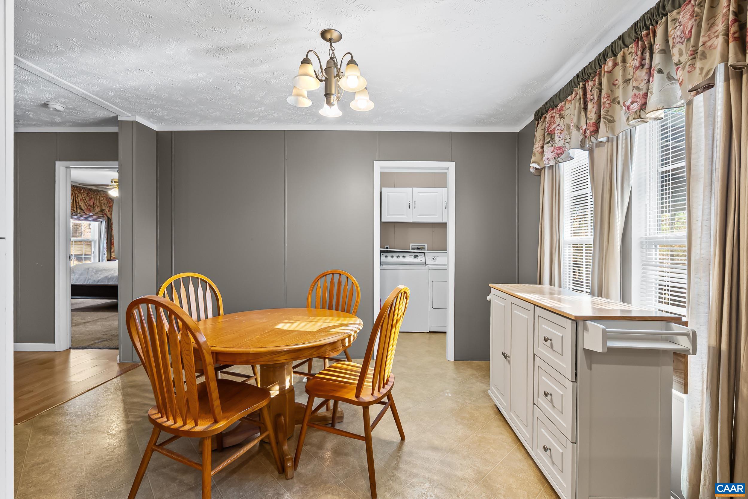 1690 Poorhouse Creek Road Appomattox, VA 24522 - Photo 8 of 44 a view of a dining room with furniture window and wooden floor